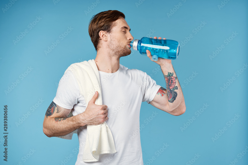 young man with bottle of water young man with bottle of water