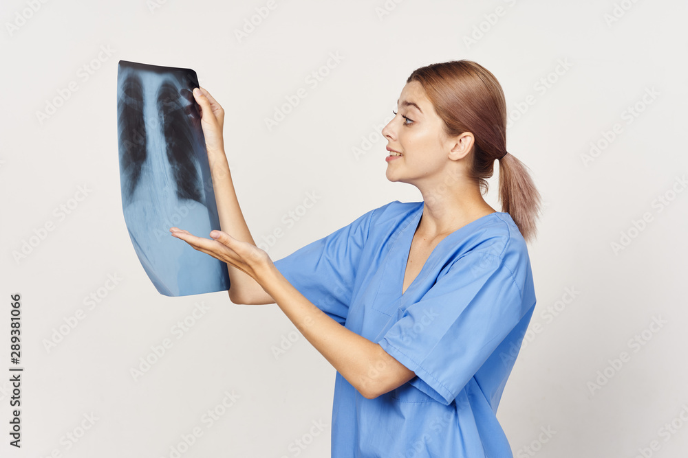 female doctor looking at an xray female doctor looking at an xray