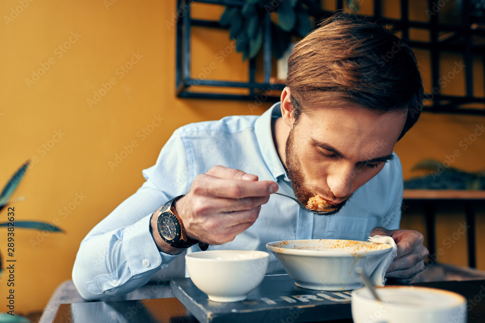 man having breakfast in kitchen man having breakfast in kitchen