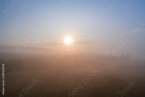 Aerial Shoot of Sunrise Light Breaking Throught the Fog