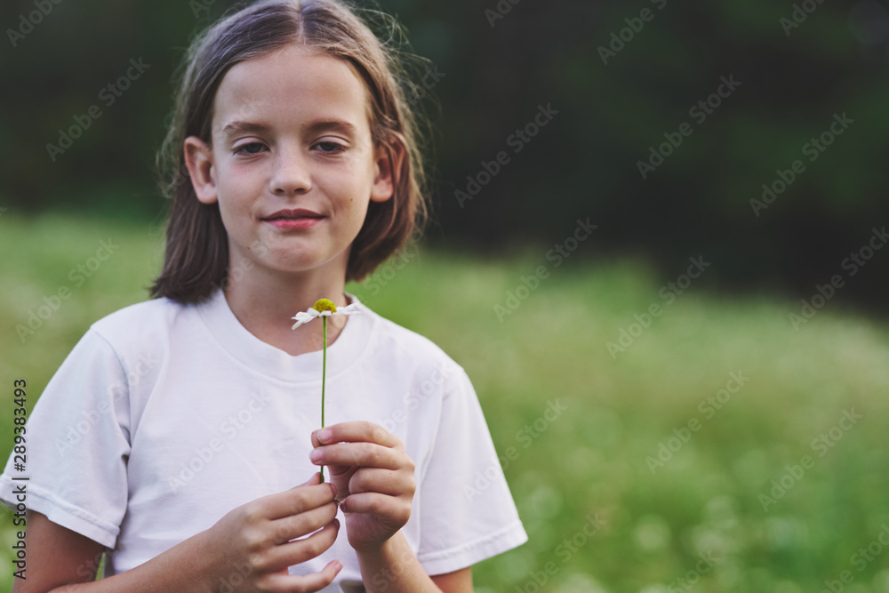 portrait of young woman blowing bubbles in the park portrait of young woman blowing bubbles in the park