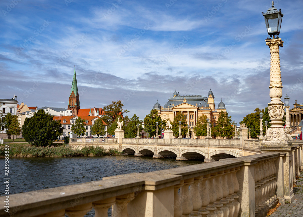 Obraz premium A view on the center of Schwerin, Mecklenburg State Theatre and the Schwerin Cathedral. Germany
