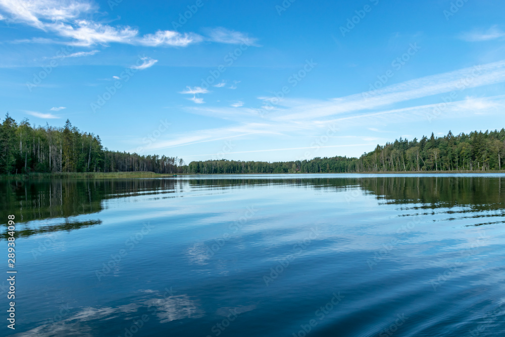 beautiful lake view, beautiful sky, Calm lake reflection against the blue sky with white clouds, Valdis lake, Turna, Latvia
