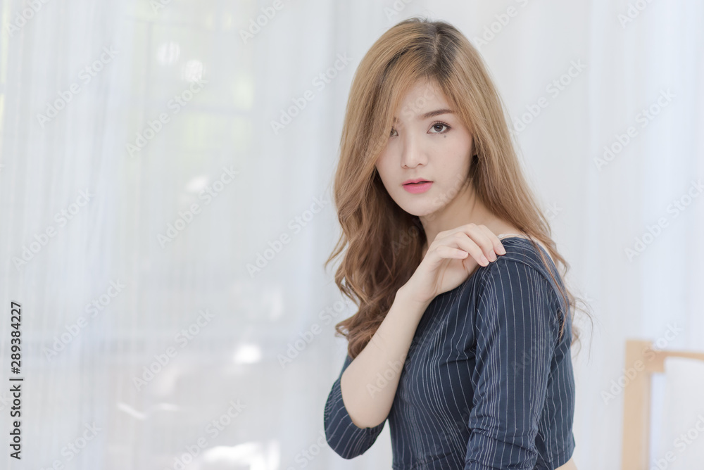 Portrait of attractive young Asian businesswoman. Beautiful Girl at home