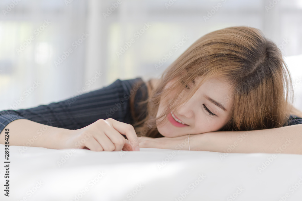 Portrait of young beautiful sexy Asian woman relax in her bedroom. Smile happy face girl Portrait of young beautiful sexy Asian woman relax in her bedroom. Smile happy face girl