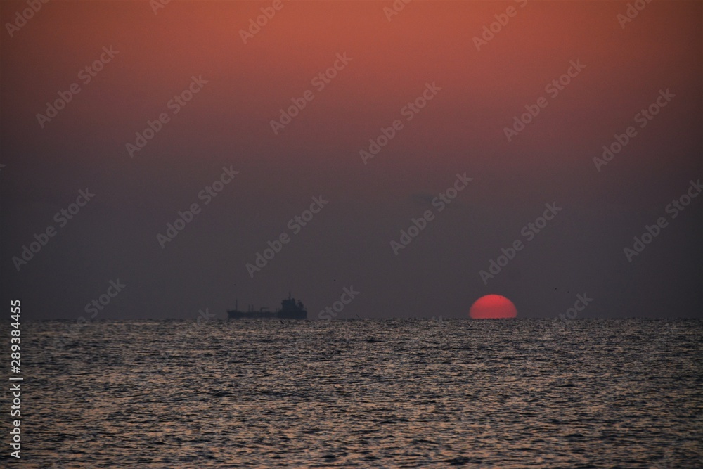 a beautiful sunrise seen from the sea beach a beautiful sunrise seen from the sea beach