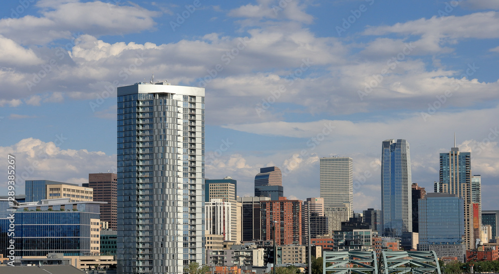 View of Denver downtown cityscape on a sunny afternoon.