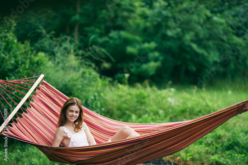 young woman relaxing in hammock