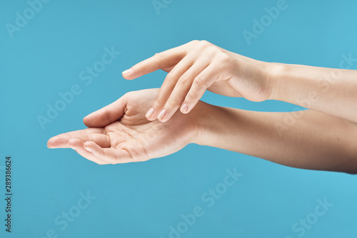 hands of man and woman on blue background © SHOTPRIME STUDIO