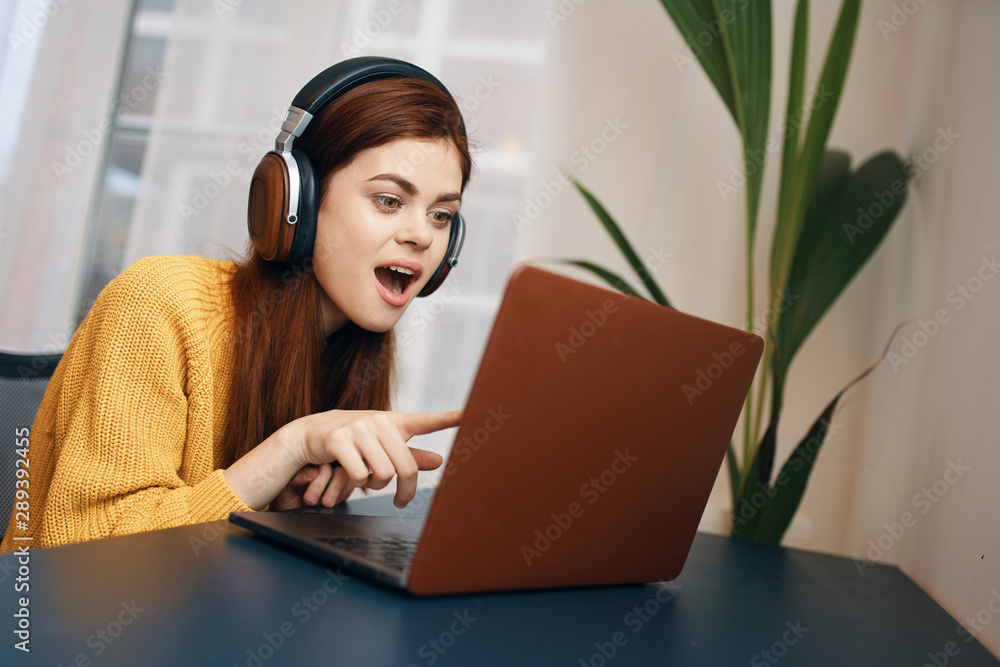 young woman working on her laptop at home young woman working on her laptop at home
