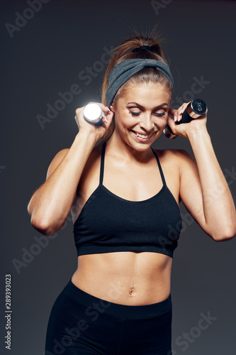 young woman with headphones listening to music