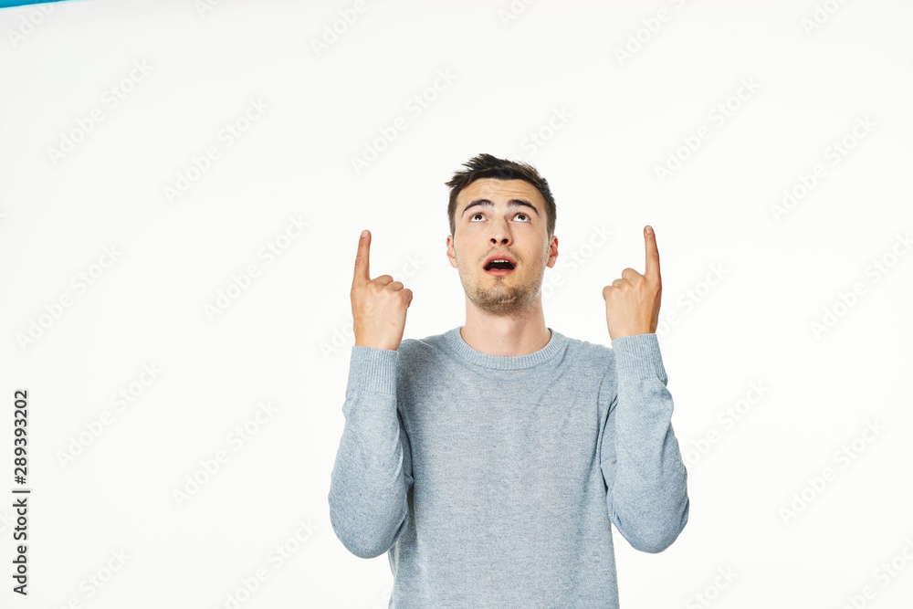 young man with arms raised young man with arms raised