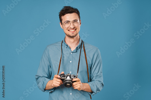 portrait of young man with camera