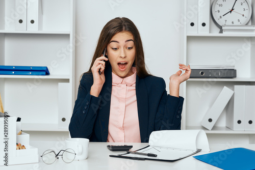 businesswoman talking on phone in office © SHOTPRIME STUDIO