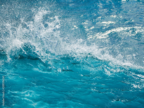 Closeup turquoise wave of the atlantic ocean.