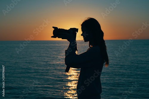 silhouette of photographer at sunset