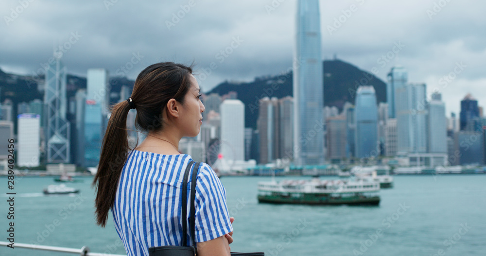 Woman look at the city view in Hong Kong Woman look at the city view in Hong Kong