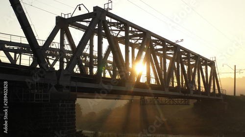 Drone view Double railway bridge over river in morning fog