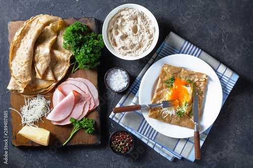 Tableau sur toile buckwheat galette with fried egg, cheese, ham