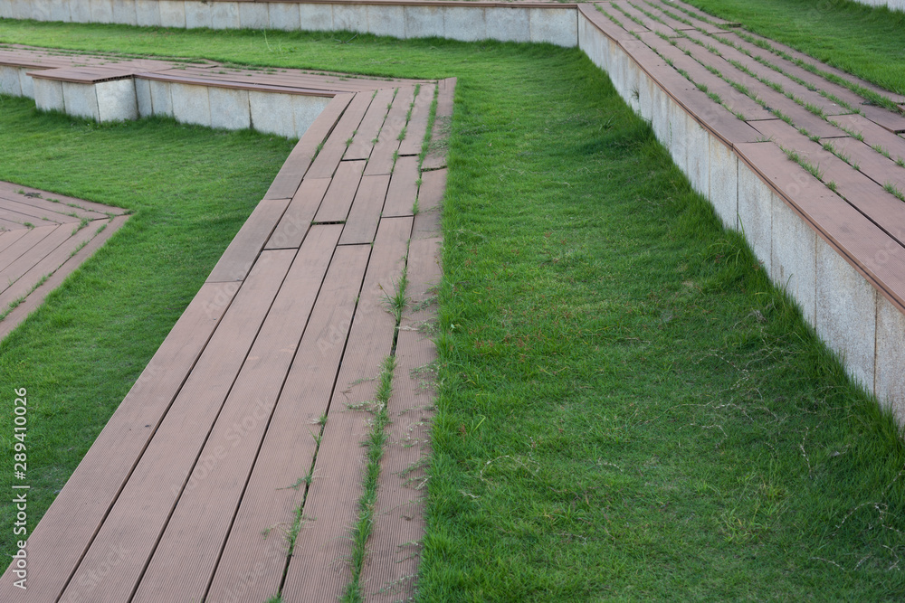 Close-up of the platform of the grass stairs in the sports park Close-up of the platform of the grass stairs in the sports park
