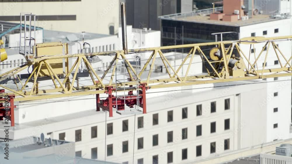 Trolley mechanism, lifting cables and jib arm in action at high-rise ...