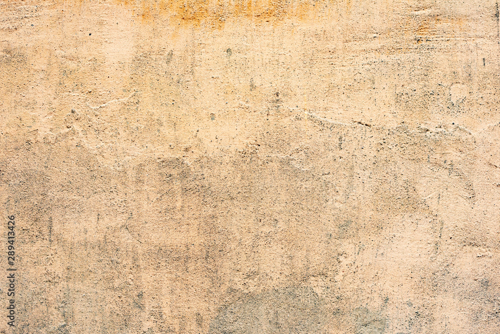 Texture of a concrete wall with cracks and scratches which can be used as a background Texture of a concrete wall with cracks and scratches which can be used as a background