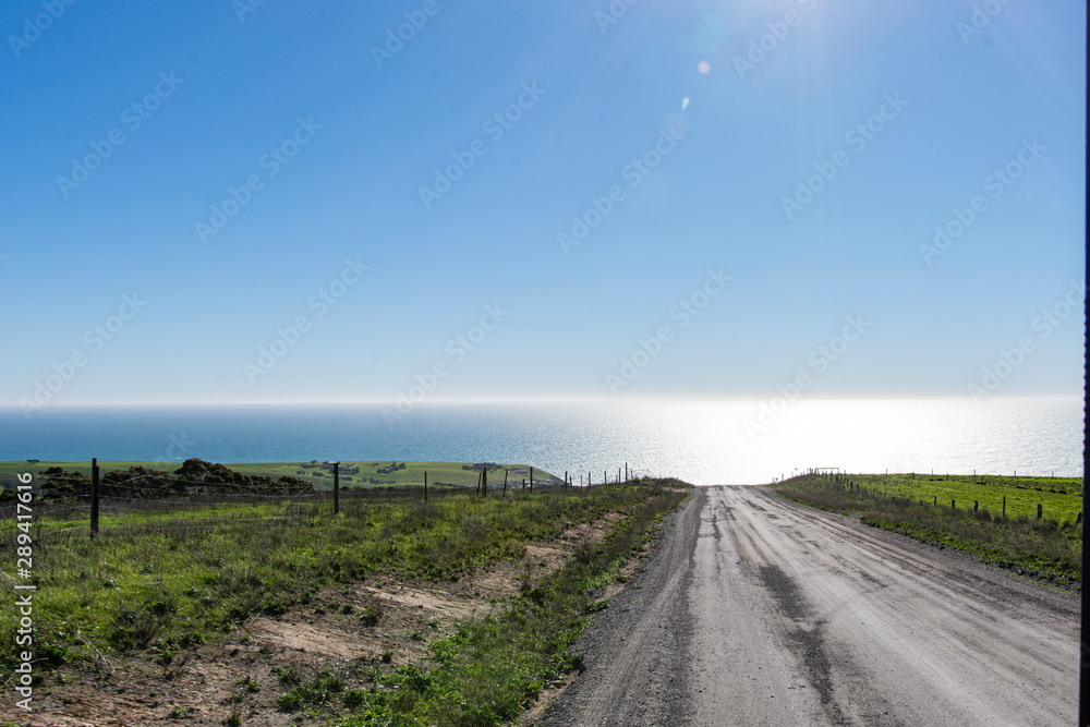 road in the field with ocean view, sky and sun Australia 2019 road in the field with ocean view, sky and sun Australia 2019