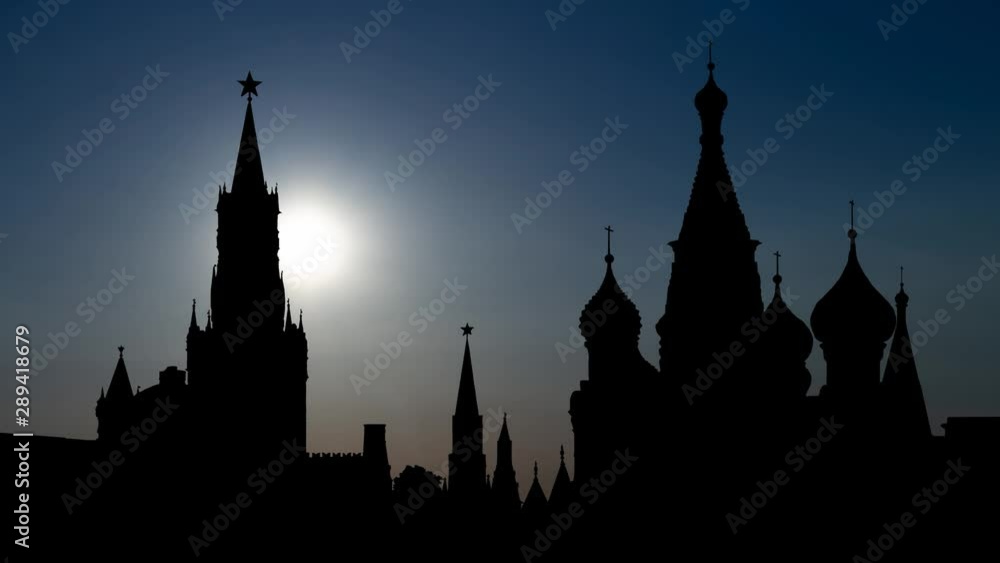 Moscow: Saint Basil's Cathedral amd Kremlin or Spasskaya Tower in Red Square, Time Lapse at Sunset, Russia, Europe Moscow: Saint Basil's Cathedral amd Kremlin or Spasskaya Tower in Red Square, Time Lapse at Sunset, Russia, Europe