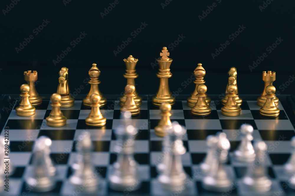 Chess game, set the board waiting to play in both gold and silver pieces Chess game, set the board waiting to play in both gold and silver pieces