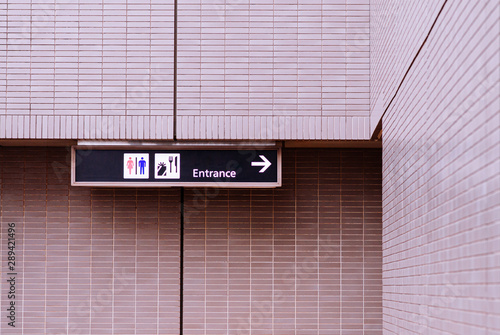 Photography Airport information sign with direction to toilet, terminal entrance and restaur