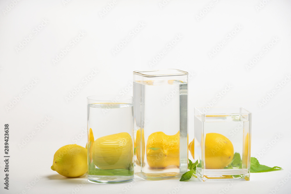Fototapeta premium Foods distorted through liquid and glass on white background.