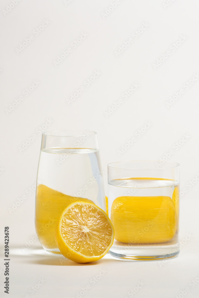Foods distorted through liquid and glass on white background. Foods distorted through liquid and glass on white background.