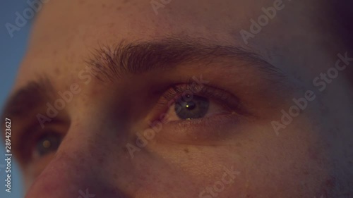 Handsome Man With The Sun Set In His Eyes As He Watches It 