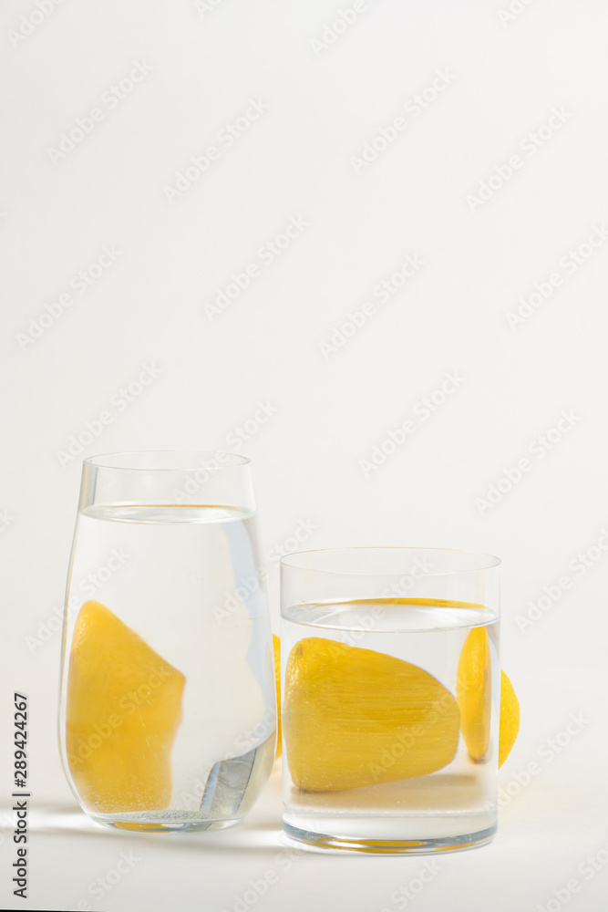 Foods distorted through liquid and glass on white background. Foods distorted through liquid and glass on white background.