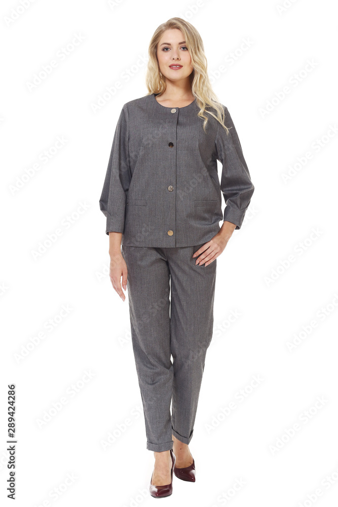 blond woman executive posing in designer formal summer pink powder pant suit blond woman executive posing in designer formal summer pink powder pant suit