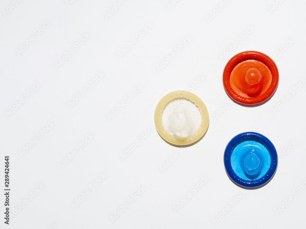 Above view unwrapped condoms on white background Above view unwrapped condoms on white background
