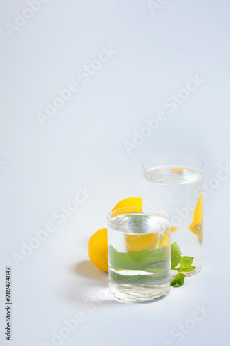 Foods distorted through liquid and glass on blue background.
