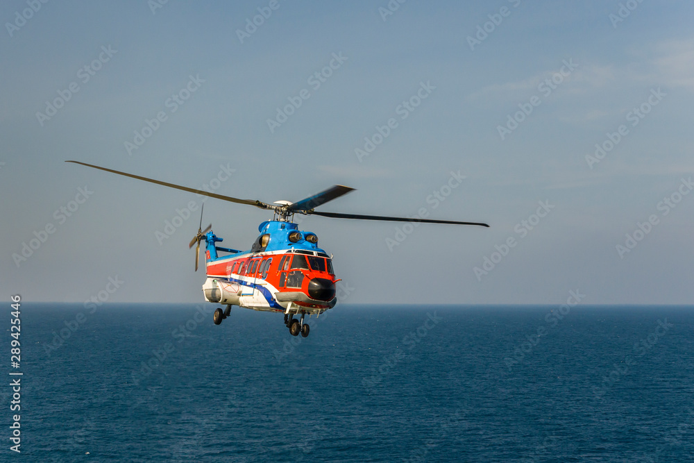 helicopter flying over the sea
