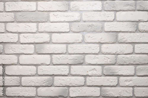 White and light grey brick wall for grunge background. Seamless pattern.