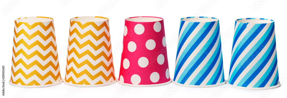 Obraz premium Paper disposable cups with colored pattern isolated on white background