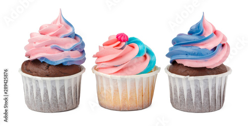 Three yummy cupcakes with icing isolated on white background