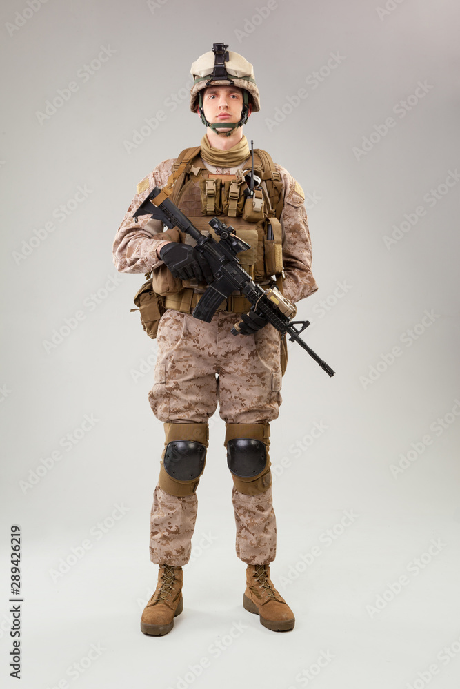 United states Marine Corps special operations command raider with weapon. Studio shot United states Marine Corps special operations command raider with weapon. Studio shot