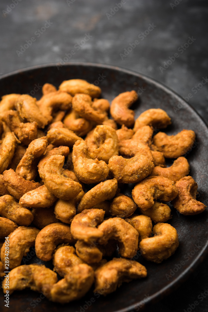 Kaju Pakoda/pakora OR Cashew Nut Fritters or bhajji, is a tasty snack from India, served as Chakna Kaju Pakoda/pakora OR Cashew Nut Fritters or bhajji, is a tasty snack from India, served as Chakna