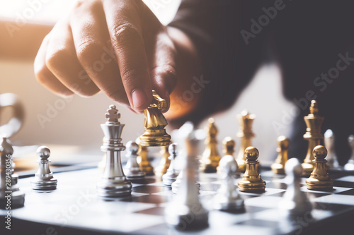 businessman playing or moving chess figure in competition success play. strategy, leadership concept