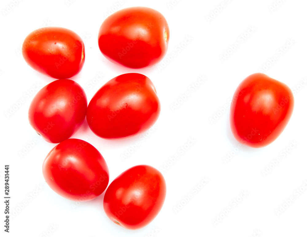 Red cherry tomatoes on a white background Red cherry tomatoes on a white background