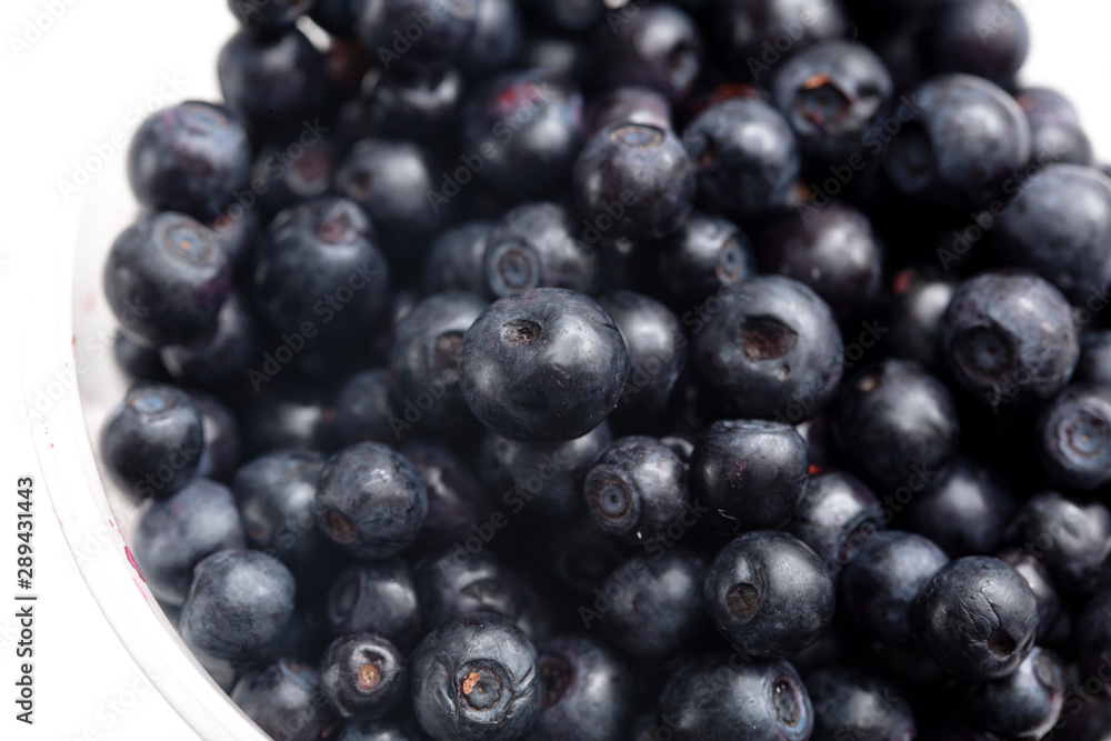 Blueberries in a glass on a white background Blueberries in a glass on a white background