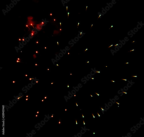 Fireworks sparkles in the night sky as background