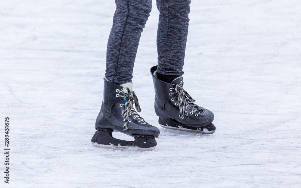 Skates on the feet of a boy in winter Skates on the feet of a boy in winter