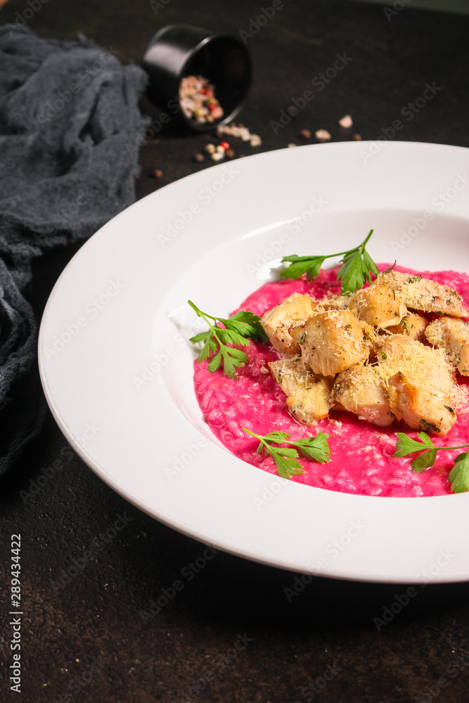 risotto chicken meat (red rice with beetroot flavor) menu concept. food background. copy space. Top view risotto chicken meat (red rice with beetroot flavor) menu concept. food background. copy space. Top view