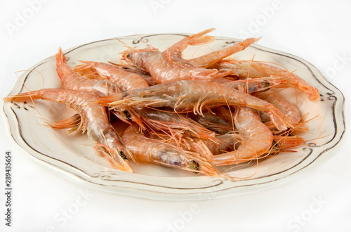 Several raw prawns served on a plate